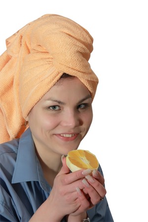 Girl with a orange. Isolated on whiteの写真素材