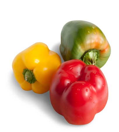 colored peppers on white. Isolated over whiteの写真素材