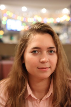 beauty blond long-haired girl in coffee roomの写真素材