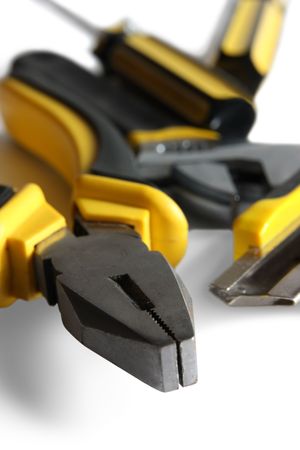 set of yellow tools over white background の写真素材