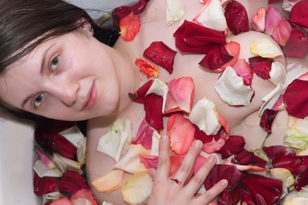 Smiling woman relaxing in bathtub at her bathroomの写真素材