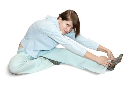 girl in light activewear is doing fitness exercises の写真素材
