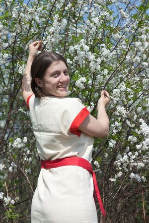 portrait of young woman in the blossoming gardenの写真素材