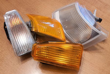 new automobile headlamp on wooden tableの写真素材