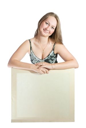 Beautiful girl holding empty white canvas. Isolated on whiteの写真素材