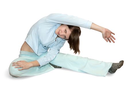 girl in light activewear is doing fitness exercises の写真素材