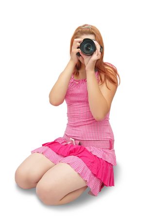 Young girl with camera isolated over whiteの写真素材