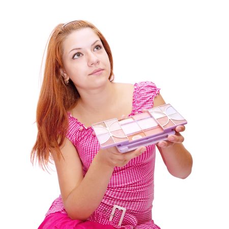 girl in pink dress with cosmetics boxの写真素材