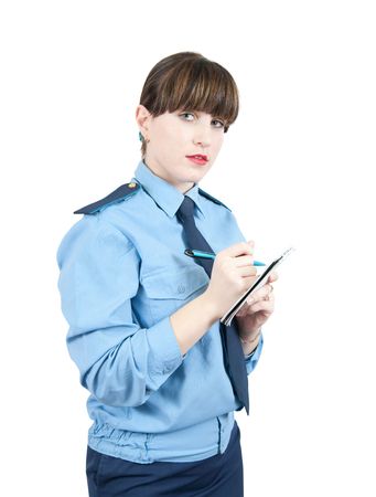 woman in uniform writing something on a notebookの写真素材