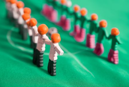 manikins of football team from plasticine on green fabricの写真素材