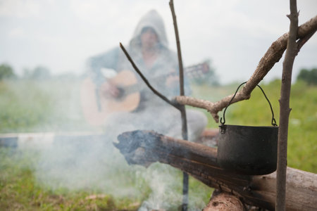 tourists kettle on fire against song man