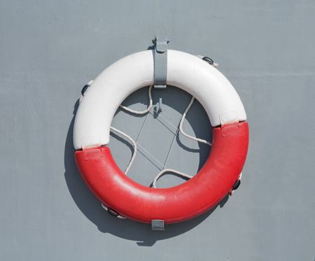 lifebuoy on a grey wall of shipの写真素材
