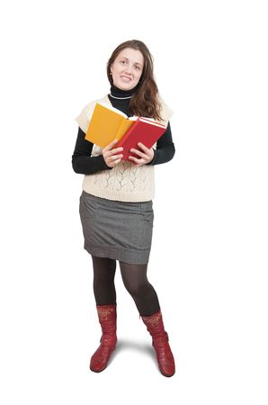 Standing girl reading book, isolated over whiteの写真素材