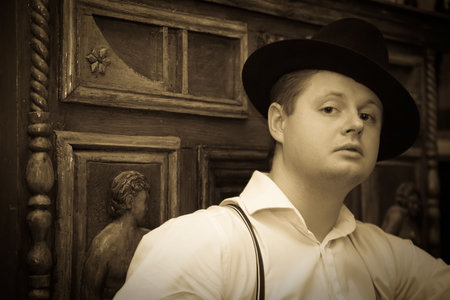 Retro portrait of man against vintage furniture