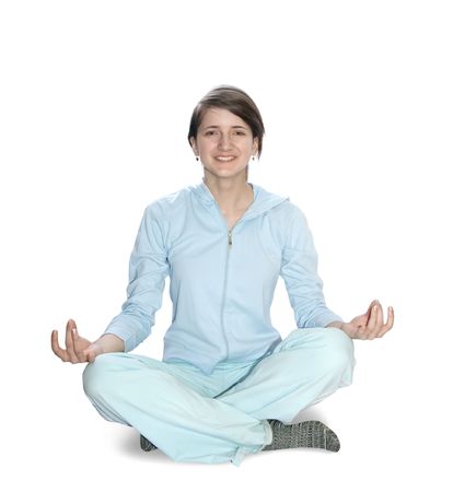 Beautiful young girl practicing yoga  over white backgroundの写真素材