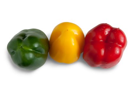 colored peppers on white. Isolated over whiteの写真素材