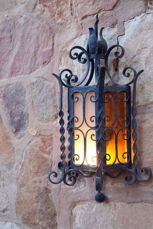  Old decoration lantern on a stones wall の写真素材