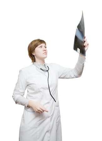 Woman doctor looking at x-ray, isolated over whiteの写真素材
