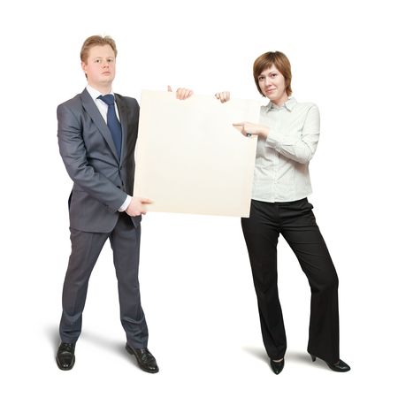 couple  in business outfit pointing at blank canvas, over white backgroundの写真素材