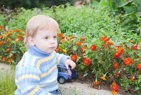 Portrait of young adorable boy against park の写真素材