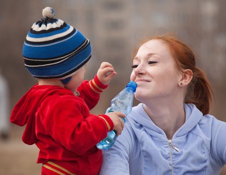 Happy mother with her son  against natureの写真素材