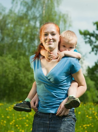 Happy mother with her son  walking outdoorの写真素材