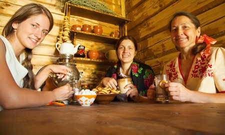  Women near  traditional russian samovar in russian traditional interiorの写真素材