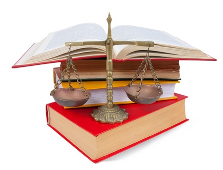  Scales of justice atop legal booksの写真素材