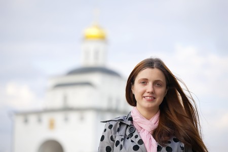 Female  tourist  against Golden Gate in Vladimir, Russiaの写真素材