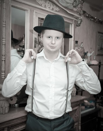 Vintage portrait of man in black fedora hatの写真素材