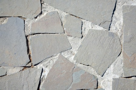 surface of vintage pebble pavement at old townの写真素材