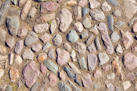 surface of vintage pebble pavement at old townの写真素材
