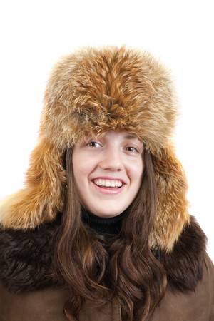 Portrait of long haired young woman in  fox cap over whiteの写真素材