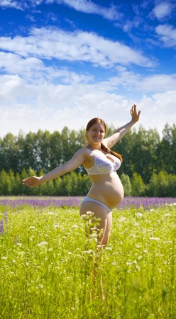 Portrait of 7 months pregnant woman in summer dayの写真素材