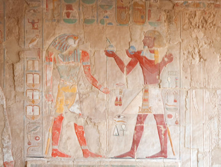 falcon-headed Horus and pharaoh. Wall decor at the Hatshepsut Temple, Egypt の写真素材