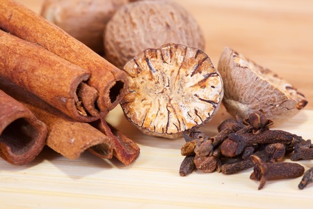 various spices   over wooden surface of tableの写真素材