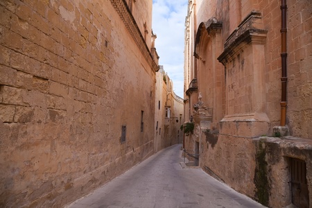 Old narrow  street of european town (Mdina, Malta)の写真素材
