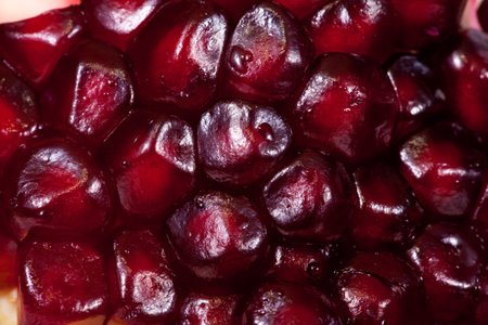 Closeup of freshness  ripe pomegranate grains background