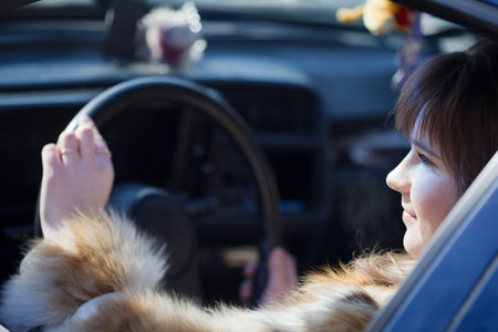 glamour female driver in her new car