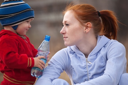 Happy mother with her son  against natureの写真素材