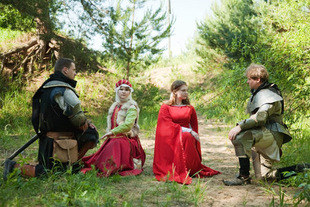 Two young medieval couple,  soldiers in armour  and women