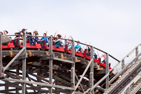 PORT AVENTURA, SPAIN - APRIL 11: People riding Theme Park Roller in April 11, 2011 in Salou, Spain. Port Aventura is bigest  Theme Park of Europeのeditorial素材