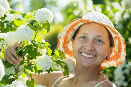 Female gardener in Roseum plant at gardenの写真素材