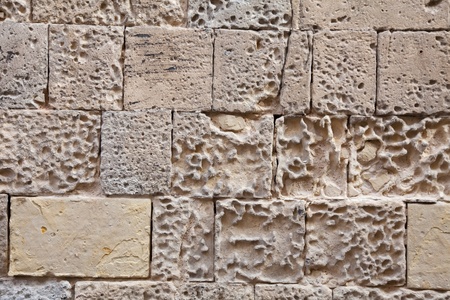Ancient stone wall texture.  Walls of times of knights. Maltaの写真素材