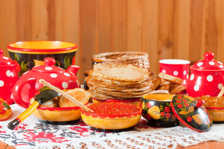 Pancake with red caviar and tea during  Shrovetideの写真素材