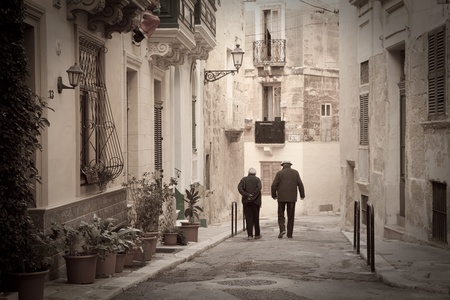 Retro photo of old narrow  street of european town (Valletta, Malta)の写真素材