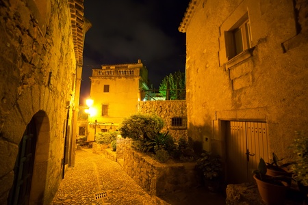 Old street of  European town in night. Tossa de Mar in night. Spainの写真素材