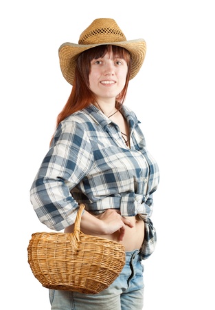 Happy pastoral  woman with basket over whiteの写真素材