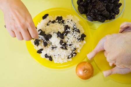 Closeup of cook making stuff for stuffed chickenの写真素材