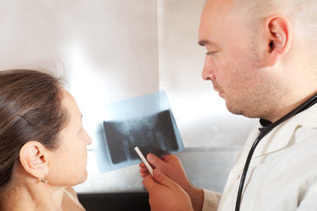 Doctor and patient discussing x-ray results